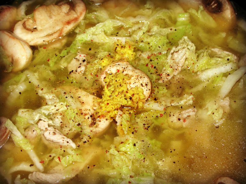  pork and cabbage soup - adding spices and seasonings