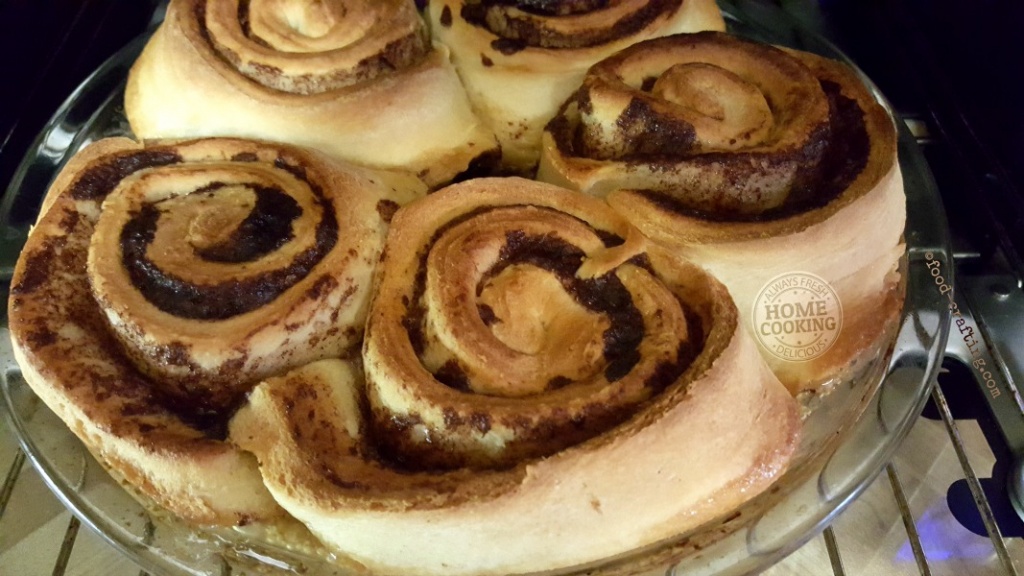 homemade sweet rolls baking in the oven