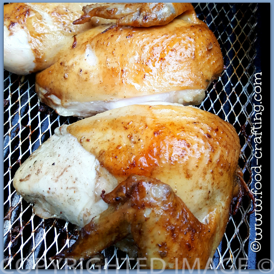 Two chicken quarters basted with apple cider vinegar marinade | food-crafting.com