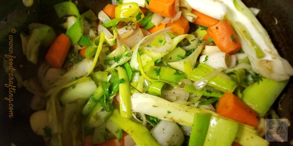 Vegetables for the country style braised duck dish are ready. Top with duck pieces.