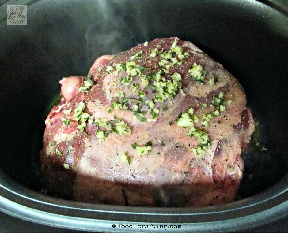 A short leg of lamb cut in the slow cooker - rubbed with olive oil and a paste of finely chopped garlic and rosemary. Melt in your mouth tender roast!